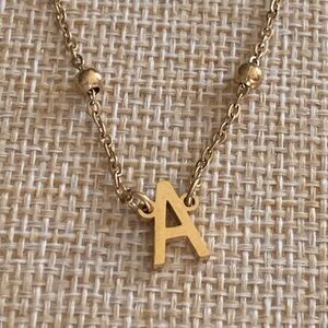 Gold tone letter A pendant, 16” sits right at collar bone.